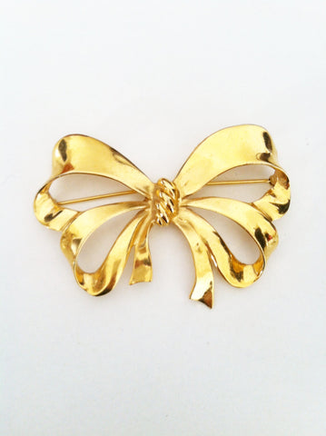 Gold bow brooch